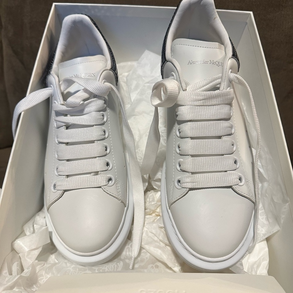 White Alexander McQueen New Tech sneakers with gunmetal back trim.